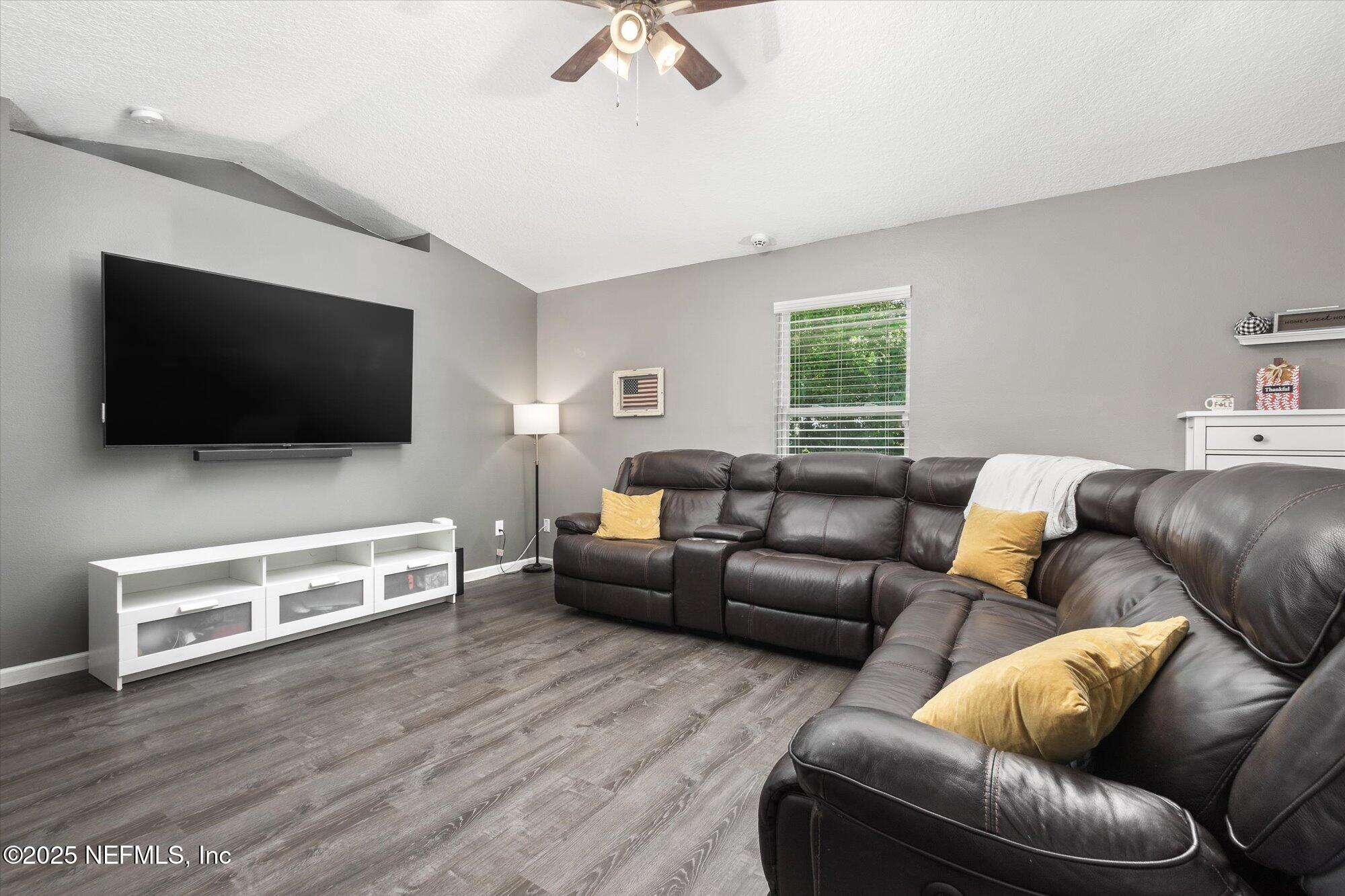 3615 Weaver Road Palatka, FL 32177 - Photo 10 of 30 a living room with furniture and a flat screen tv