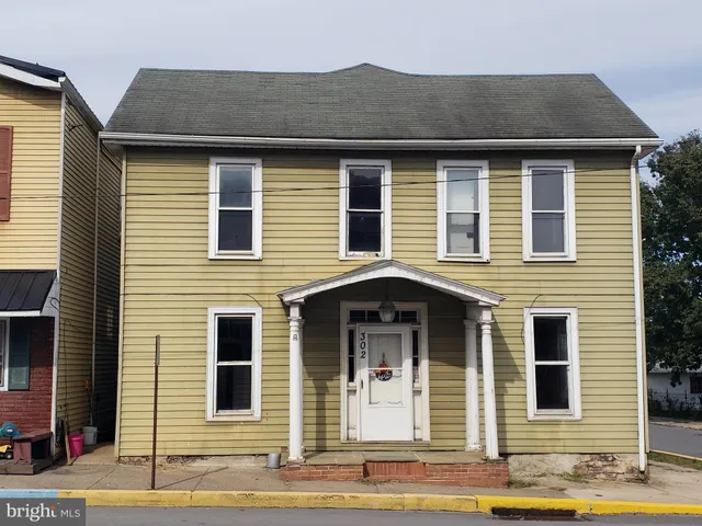 a front view of a house with a garage