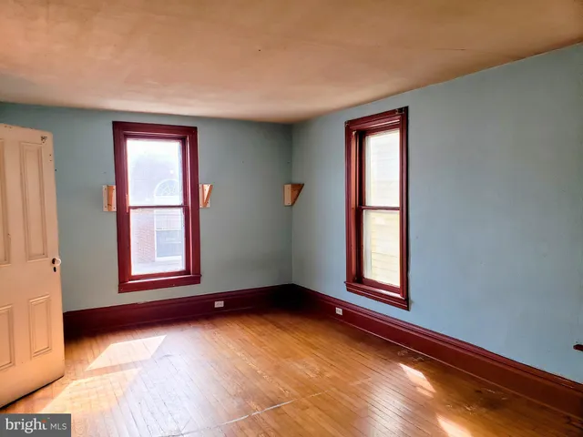 an empty room with windows
