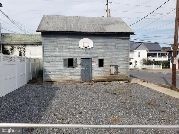 a front view of a house with parking area