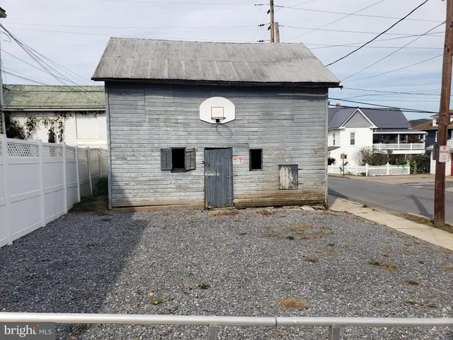 a front view of a house with parking area
