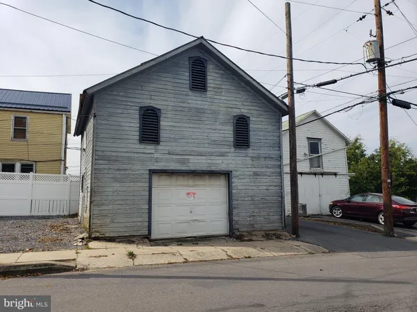 a front view of a house with garage