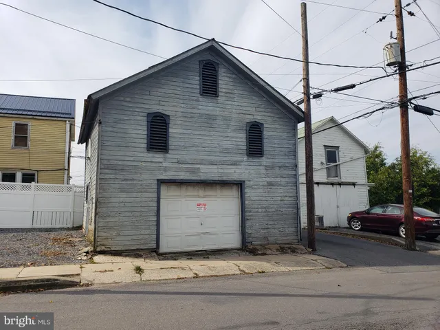a front view of a house with garage