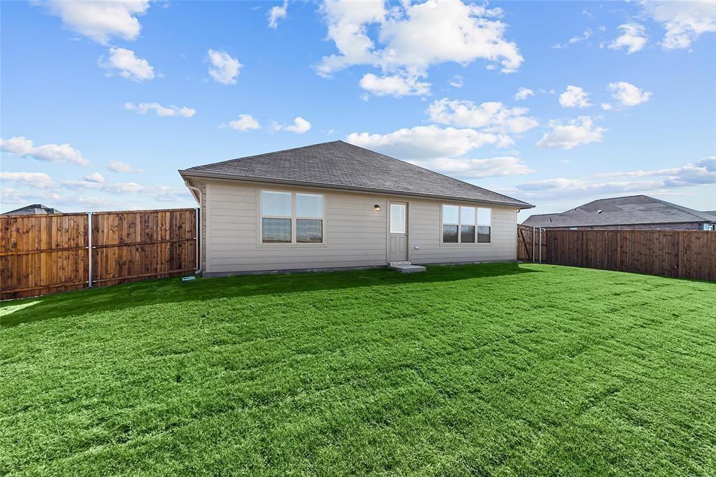 1504 Foxglove Van Alstyne, TX 75495 - Photo 12 of 12 a view of a house with a back yard