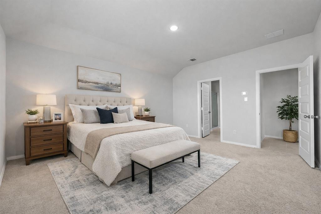 1504 Foxglove Van Alstyne, TX 75495 - Photo 4 of 12 a bedroom with a bed and a chandelier