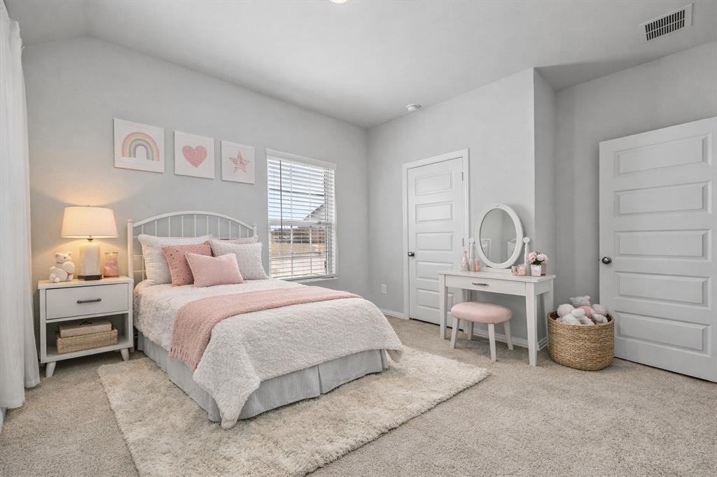 1504 Foxglove Van Alstyne, TX 75495 - Photo 7 of 12 a bedroom with a bed and a chair