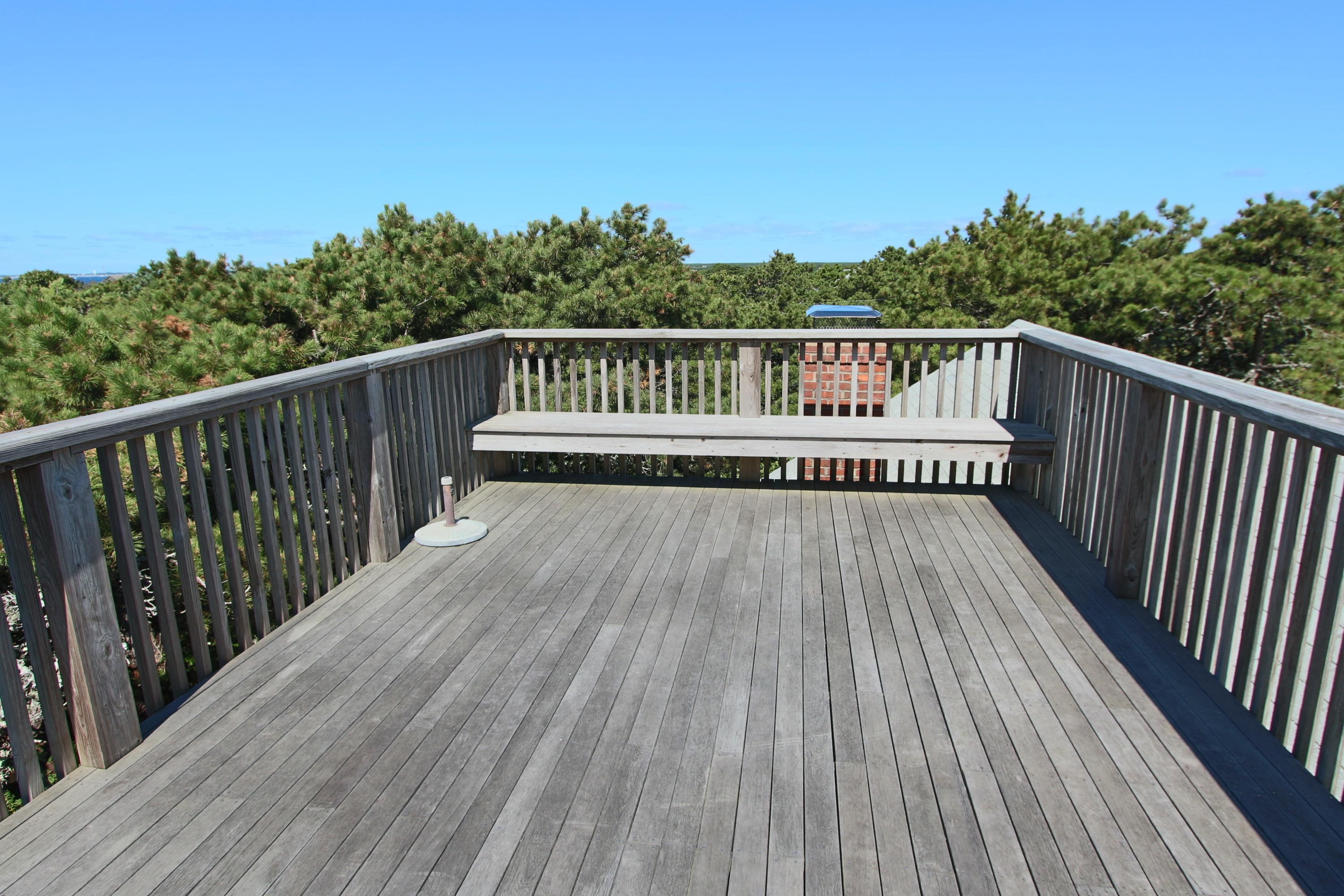26 Fishermans Road Truro, MA 02666 - Photo 21 of 29 a view of balcony with wooden floor and fence