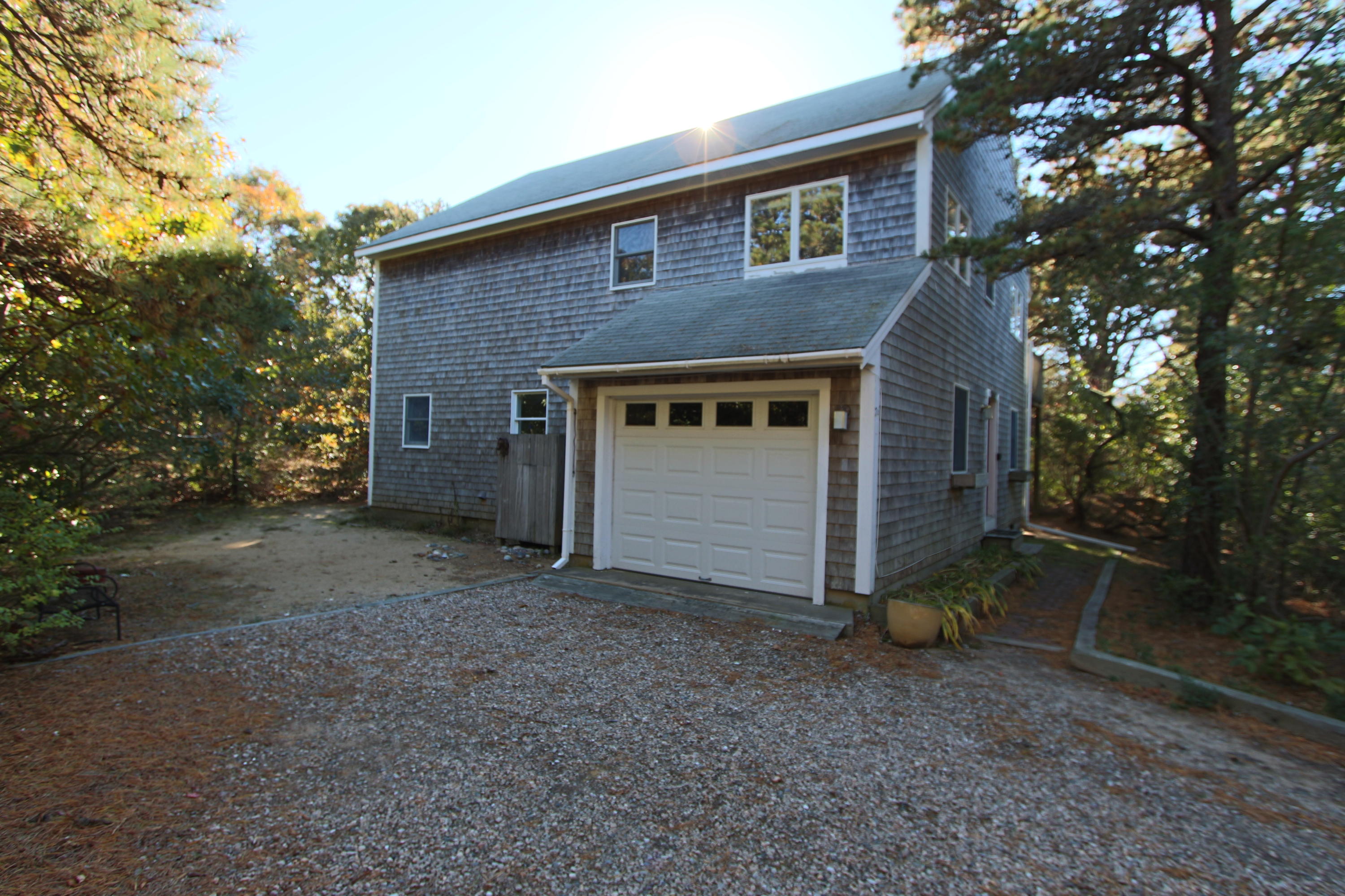 26 Fishermans Road Truro, MA 02666 - Photo 29 of 29 a view of a house with a yard and large tree