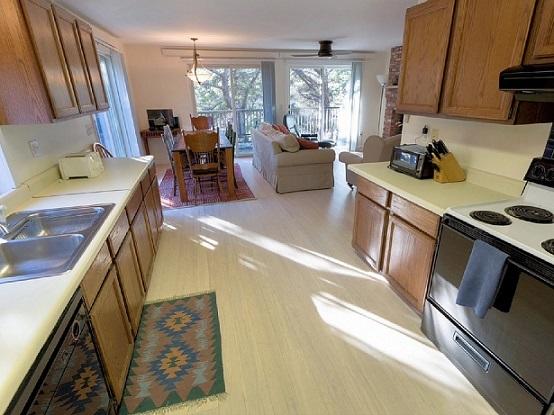 26 Fishermans Road Truro, MA 02666 - Photo 8 of 29 a kitchen with furniture a window and stainless steel appliances
