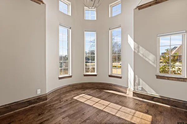 a view of a kitchen counter top space with stainless steel appliances granite countertop a sink and a large window