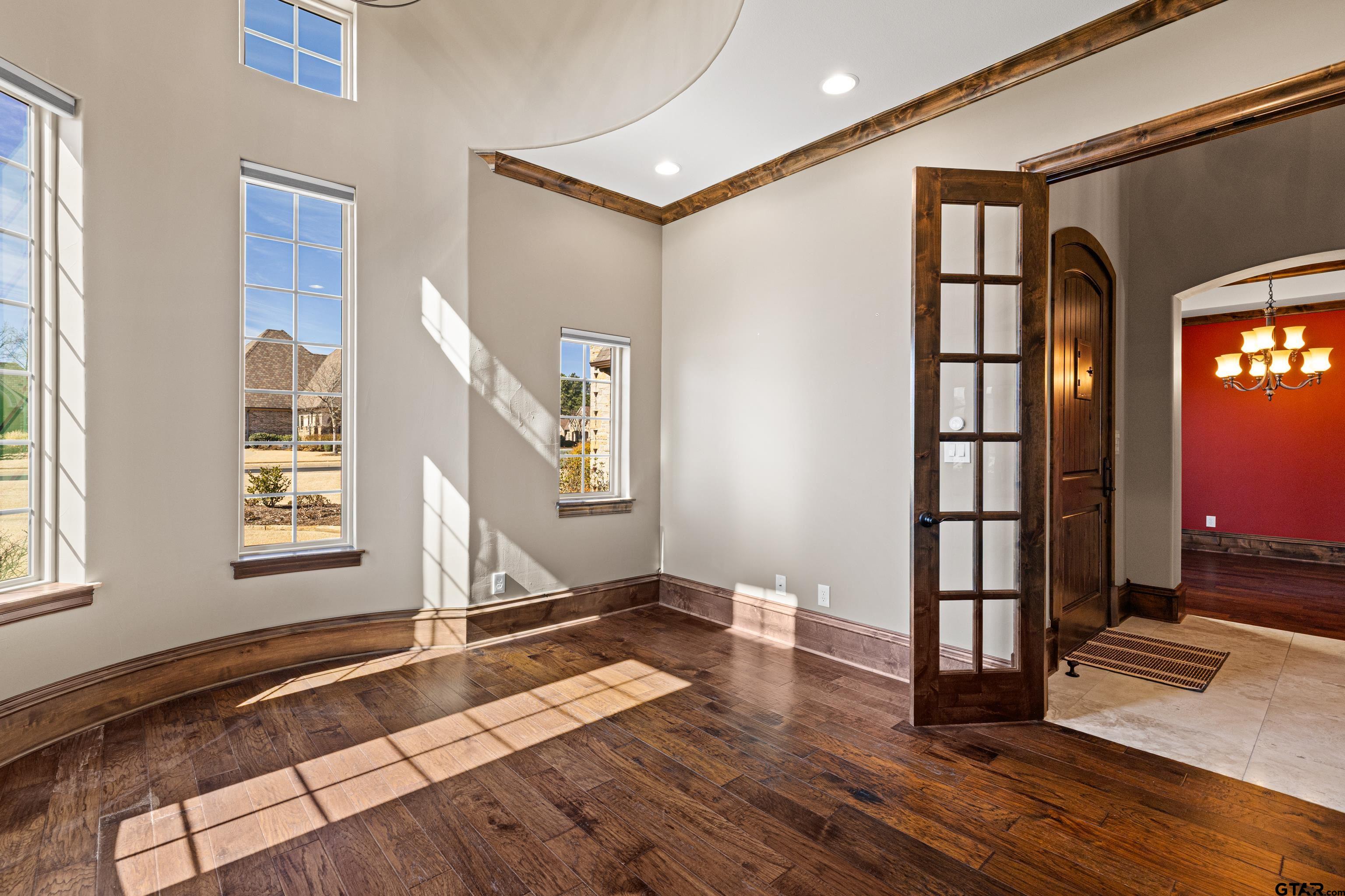 4314 Pecan Ridge Crossing Longview, TX 75605 - Photo 12 of 47 a view of an entryway with wooden floor and door