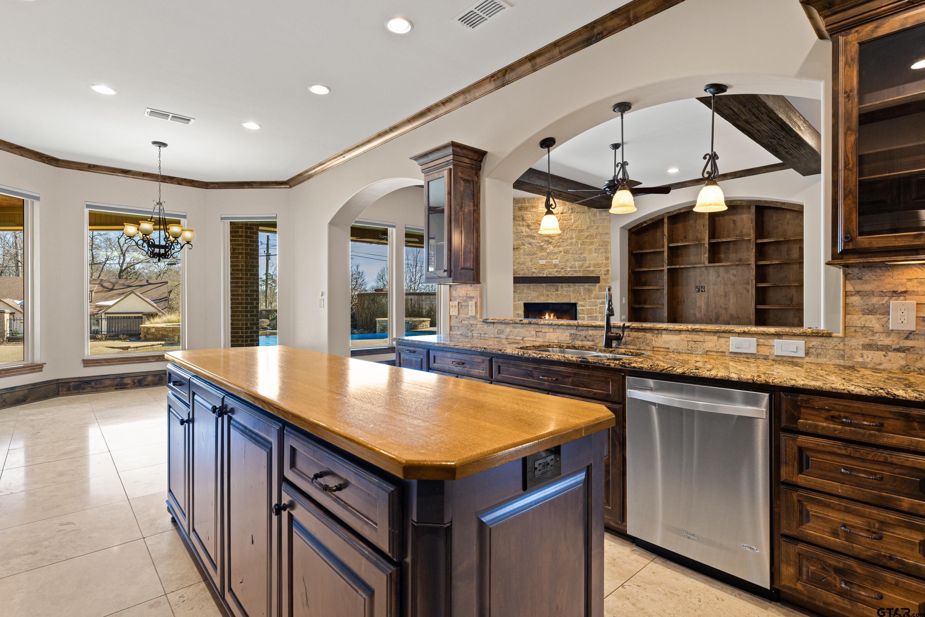 4314 Pecan Ridge Crossing Longview, TX 75605 - Photo 19 of 47 a view of a kitchen counter top space with stainless steel appliances granite countertop a sink and a large window