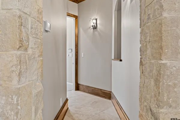 a bathroom with a granite countertop sink mirror vanity and toilet
