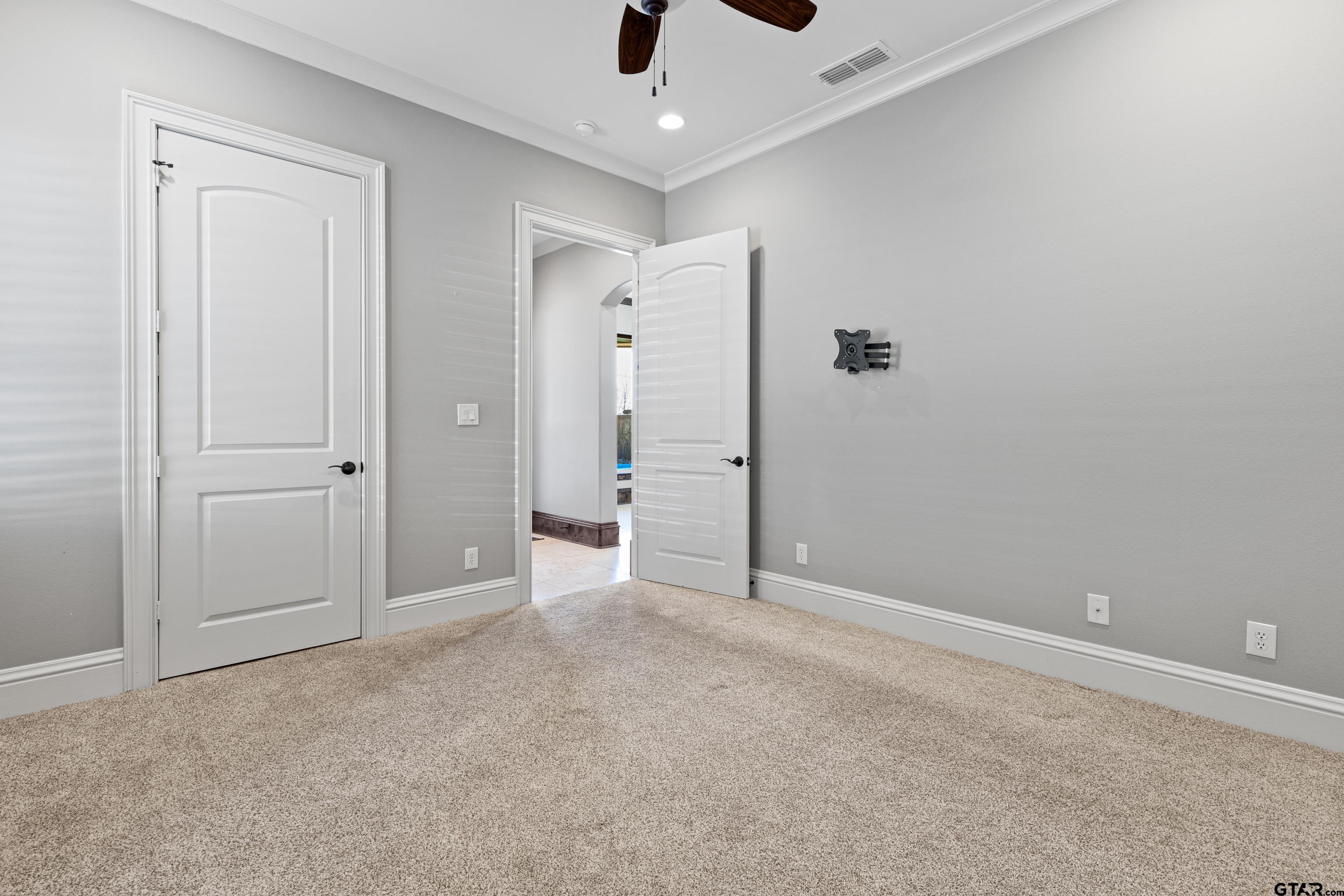 4314 Pecan Ridge Crossing Longview, TX 75605 - Photo 28 of 47 an empty room with closet and a chandelier fan