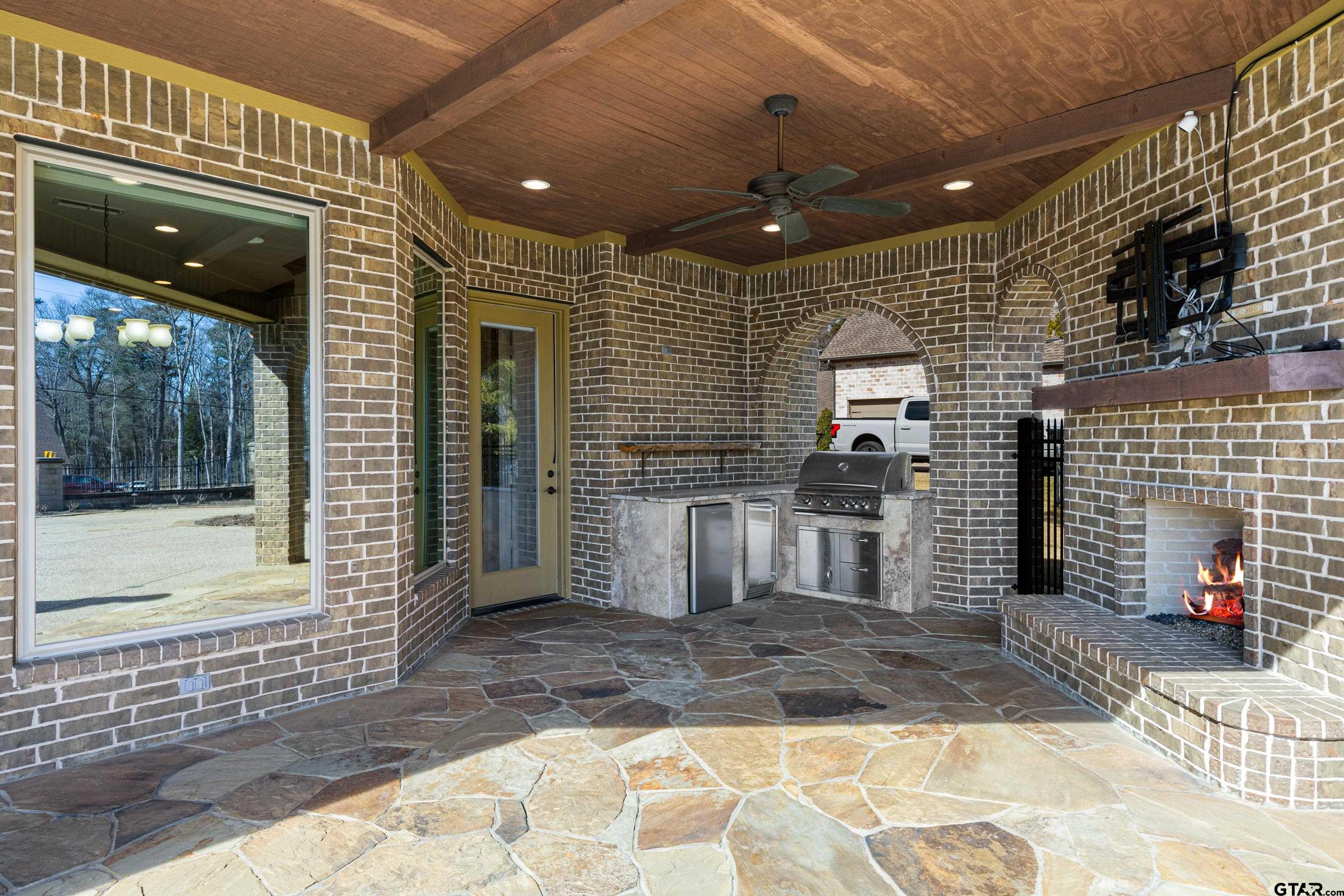 4314 Pecan Ridge Crossing Longview, TX 75605 - Photo 45 of 47 a view of a patio with table and chairs and potted plants