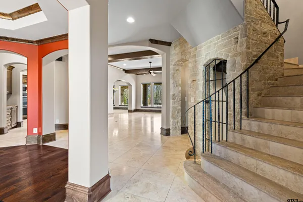 a view of front door with hallway and stairs