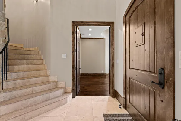 a view of a livingroom with a fireplace and window