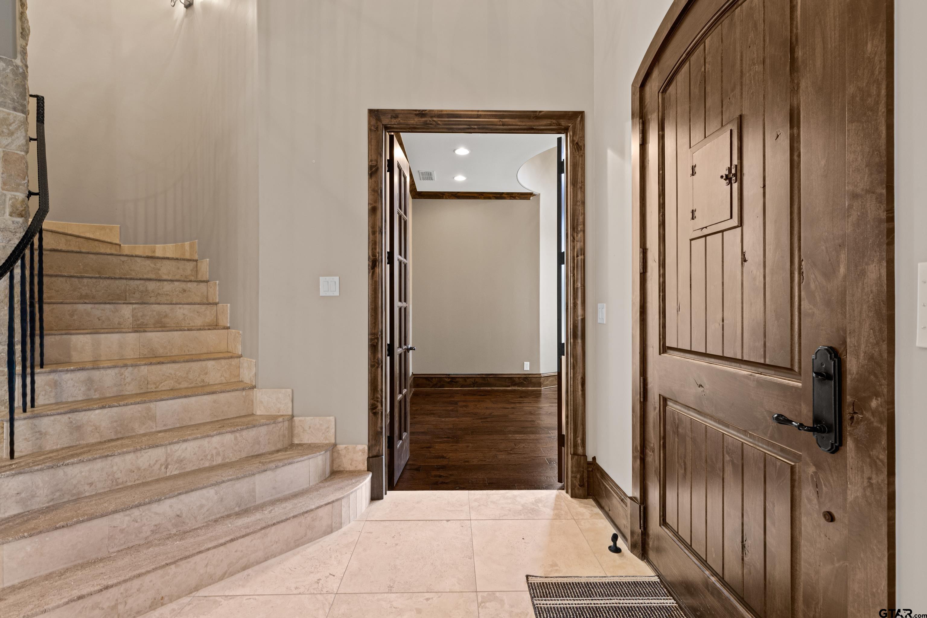 4314 Pecan Ridge Crossing Longview, TX 75605 - Photo 10 of 47 a view of front door with hallway and stairs