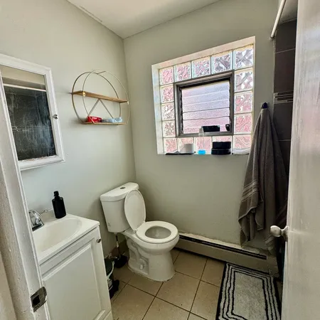 a bathroom with a toilet and a sink