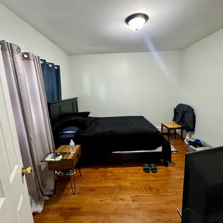 a living room with furniture rug and a window