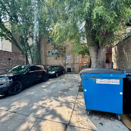a view of street with parked cars