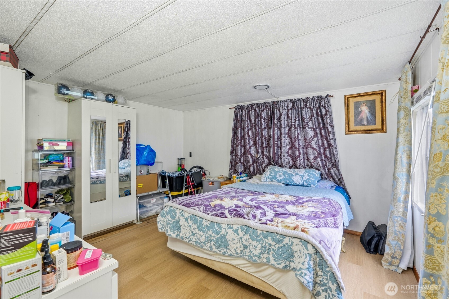 11330 East Riverside Drive, Unit 25 Bothell, WA 98011 - Photo 14 of 19 a bedroom with a bed and a window