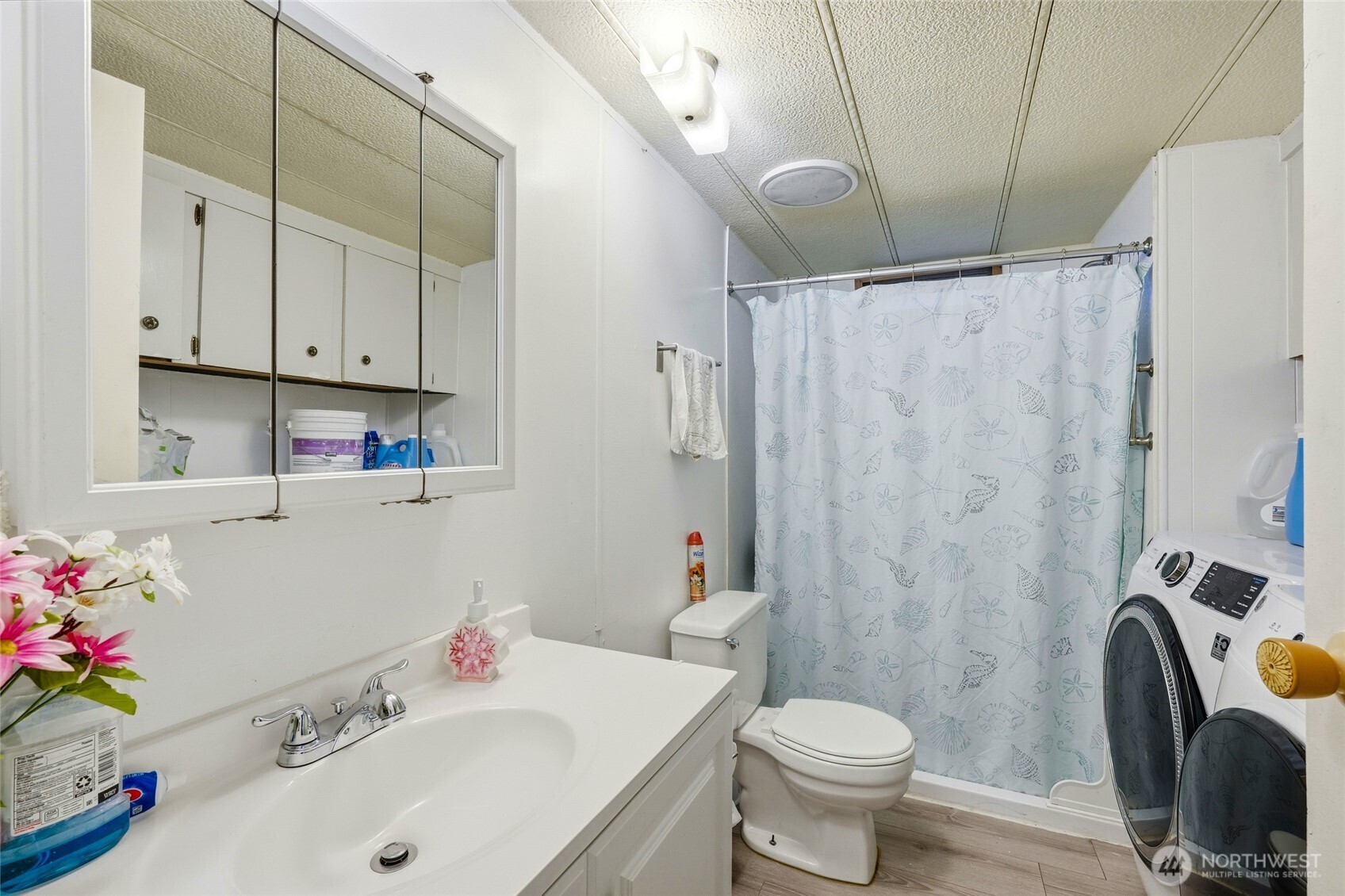 11330 East Riverside Drive, Unit 25 Bothell, WA 98011 - Photo 15 of 19 a bathroom with a sink toilet and shower