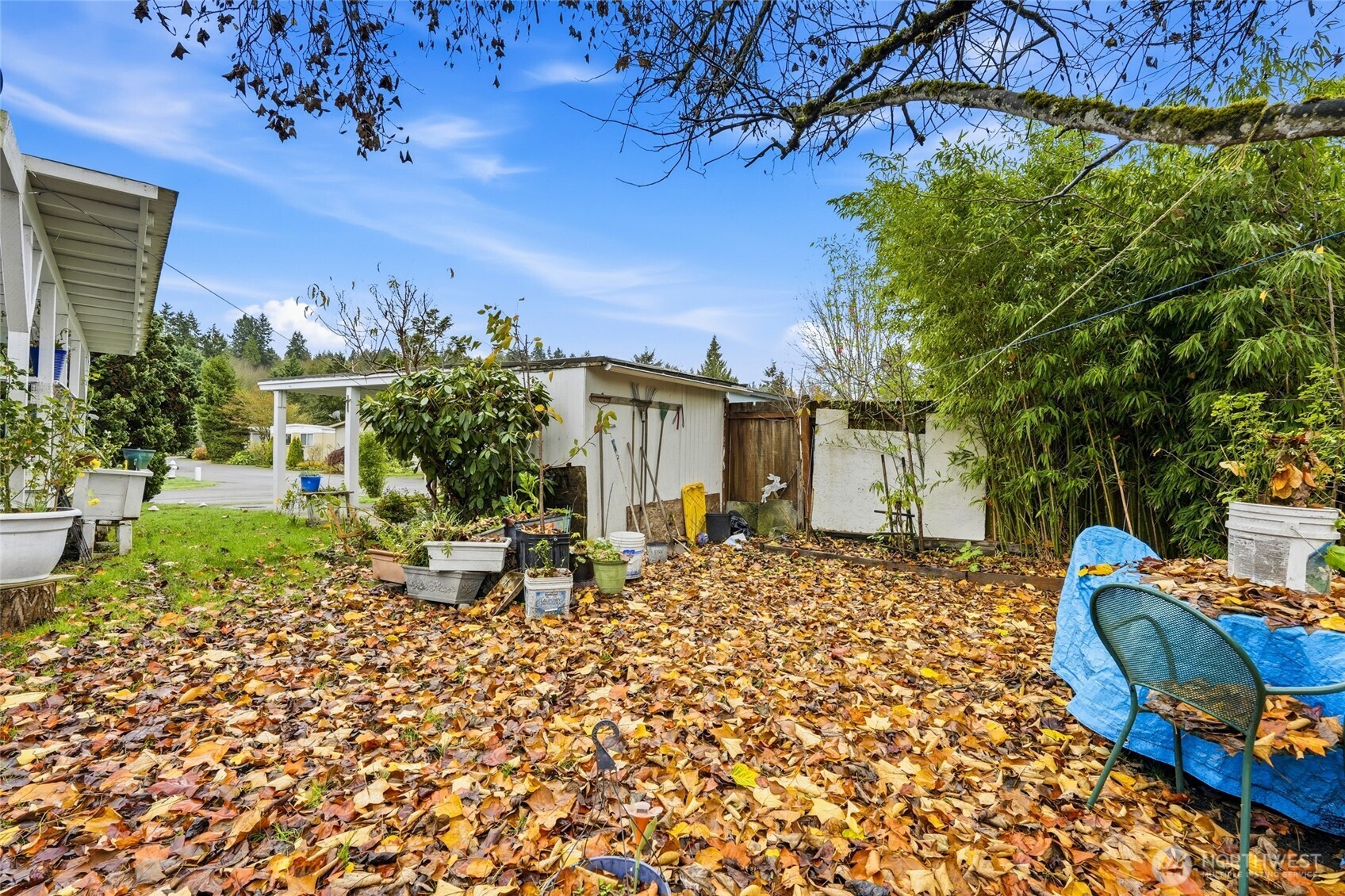 11330 East Riverside Drive, Unit 25 Bothell, WA 98011 - Photo 18 of 19 a front view of a house with a yard