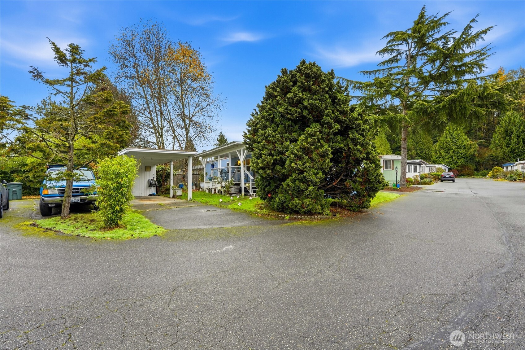11330 East Riverside Drive, Unit 25 Bothell, WA 98011 - Photo 3 of 19 a view of a house with basketball court