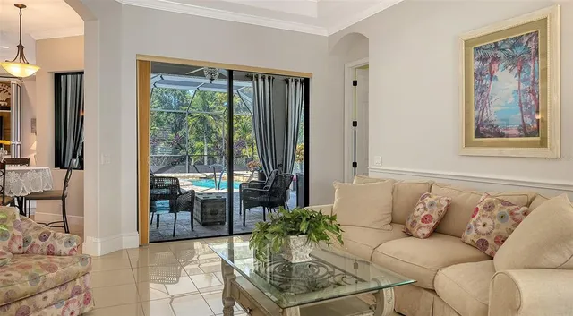 a view of a dining room with furniture and window
