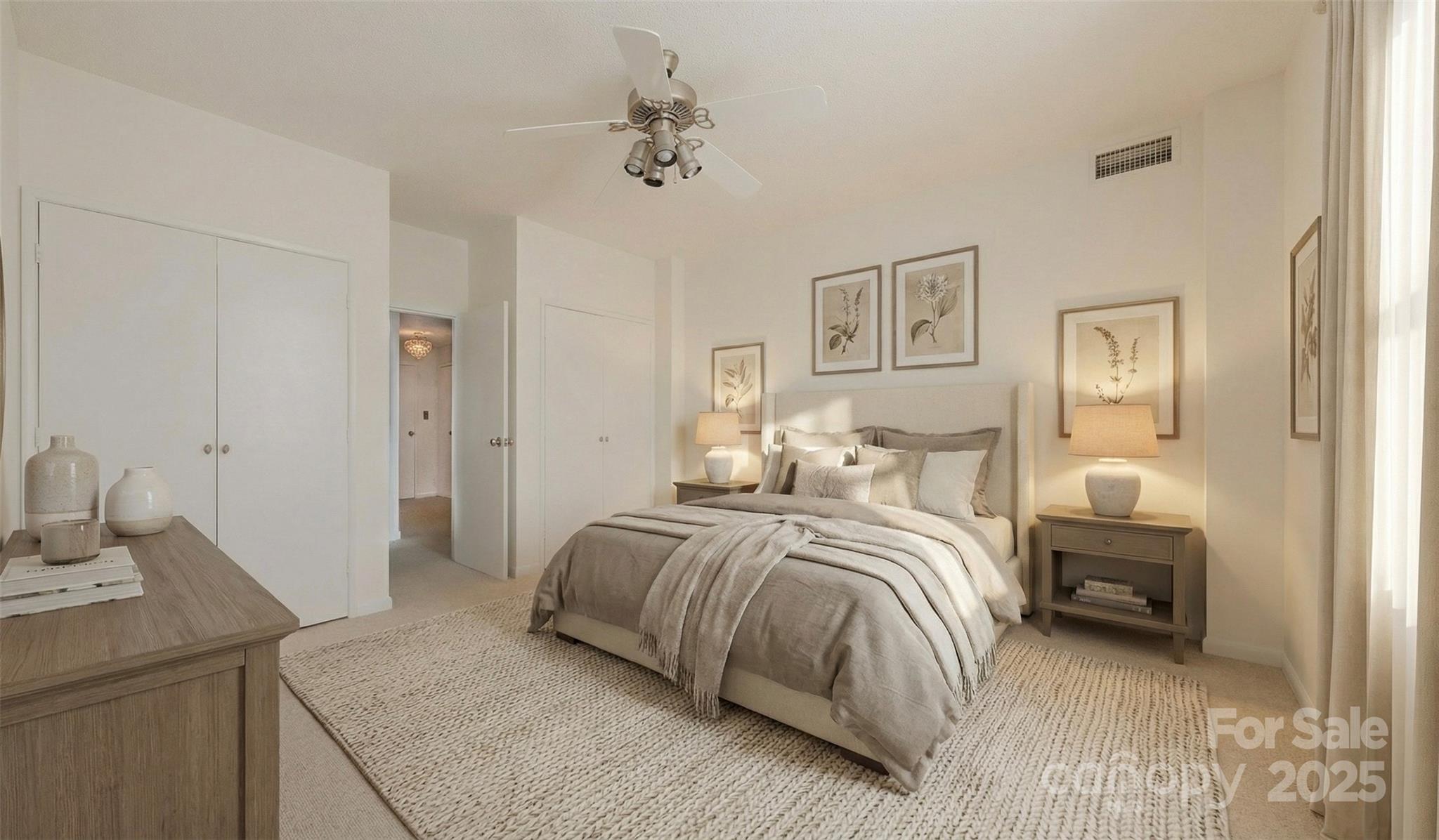 1300 Reece Road, Unit 302 Charlotte, NC 28209 - Photo 11 of 23 a bedroom with a bed and a chandelier