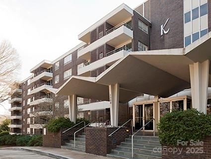 1300 Reece Road, Unit 302 Charlotte, NC 28209 - Photo 2 of 23 a front view of a building with street