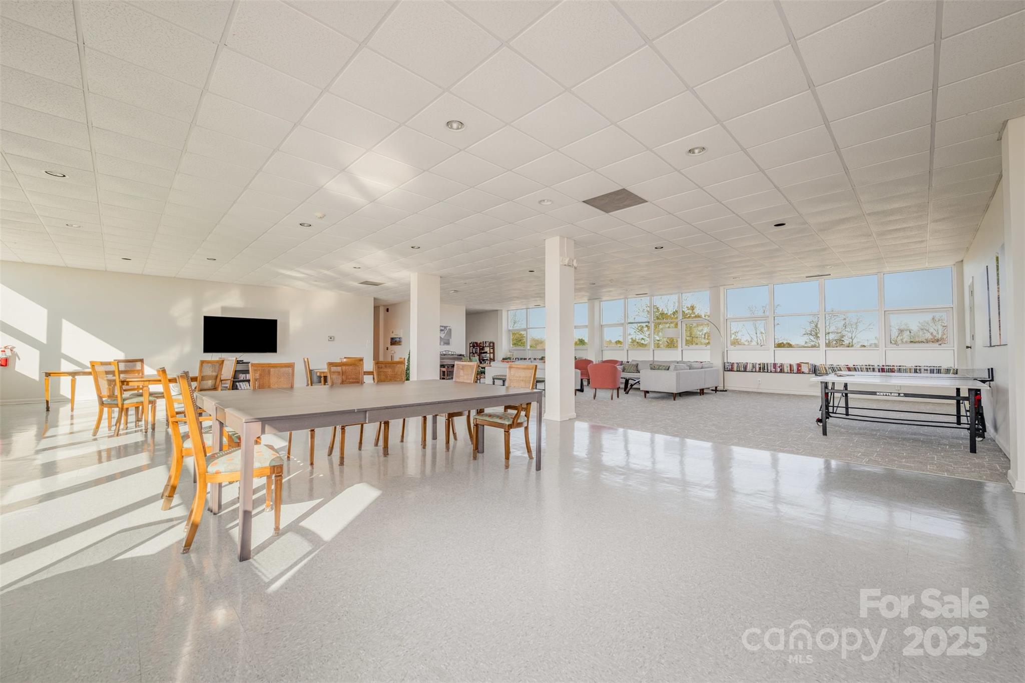 1300 Reece Road, Unit 302 Charlotte, NC 28209 - Photo 22 of 23 a living room with furniture and a flat screen tv