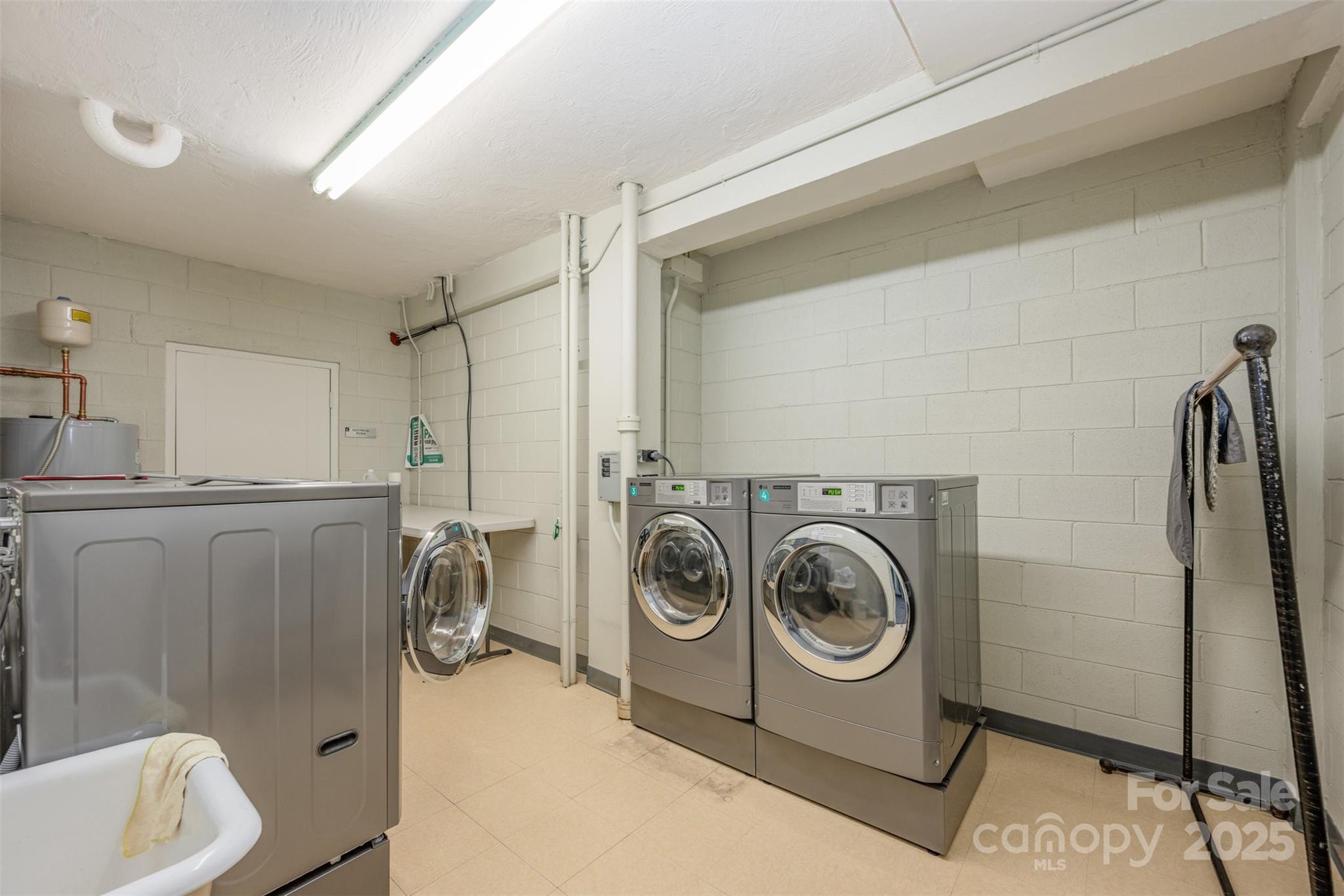 1300 Reece Road, Unit 302 Charlotte, NC 28209 - Photo 23 of 23 a utility room with dryer and washer