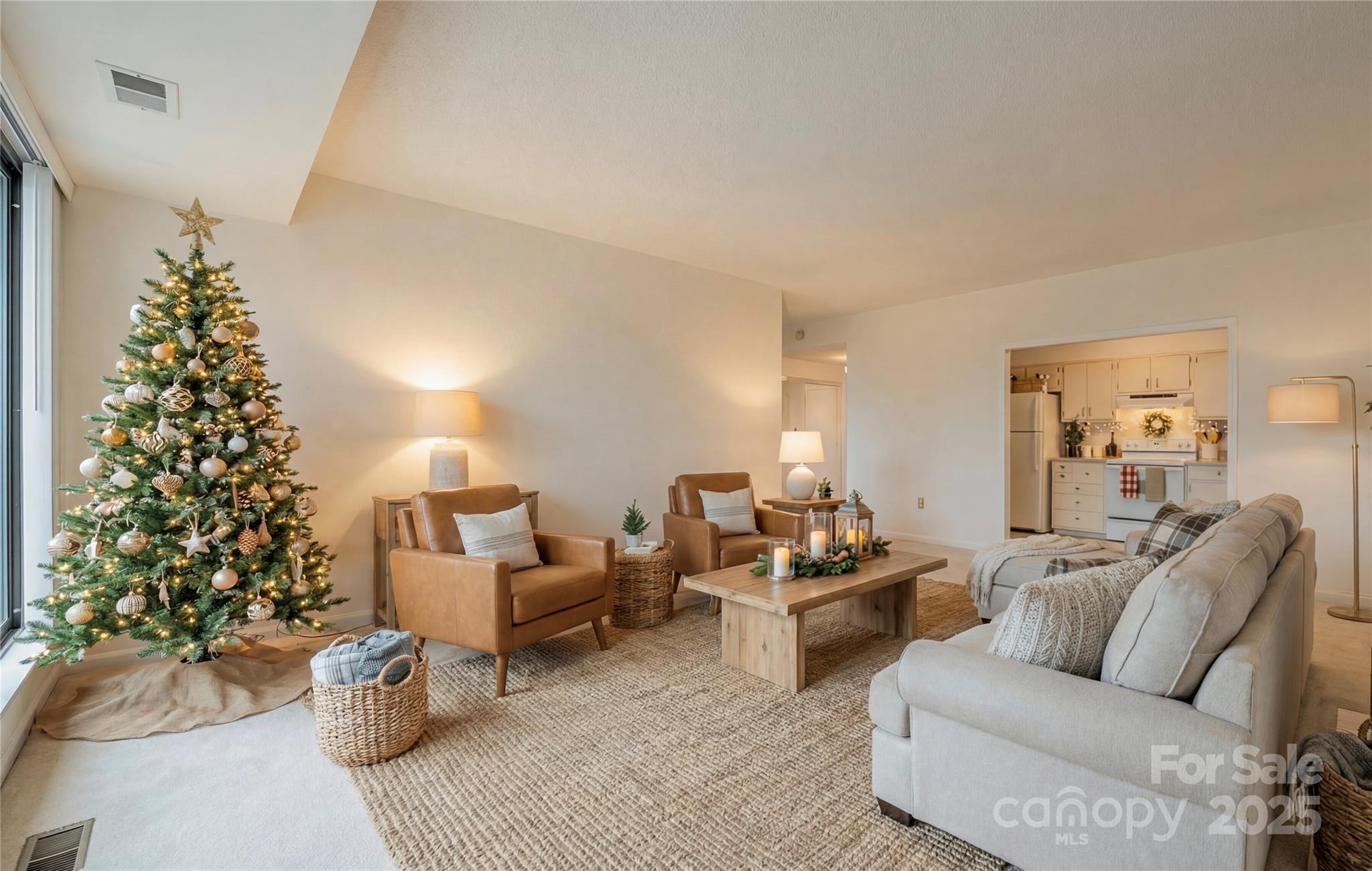 1300 Reece Road, Unit 302 Charlotte, NC 28209 - Photo 7 of 23 a living room with furniture and a potted plant