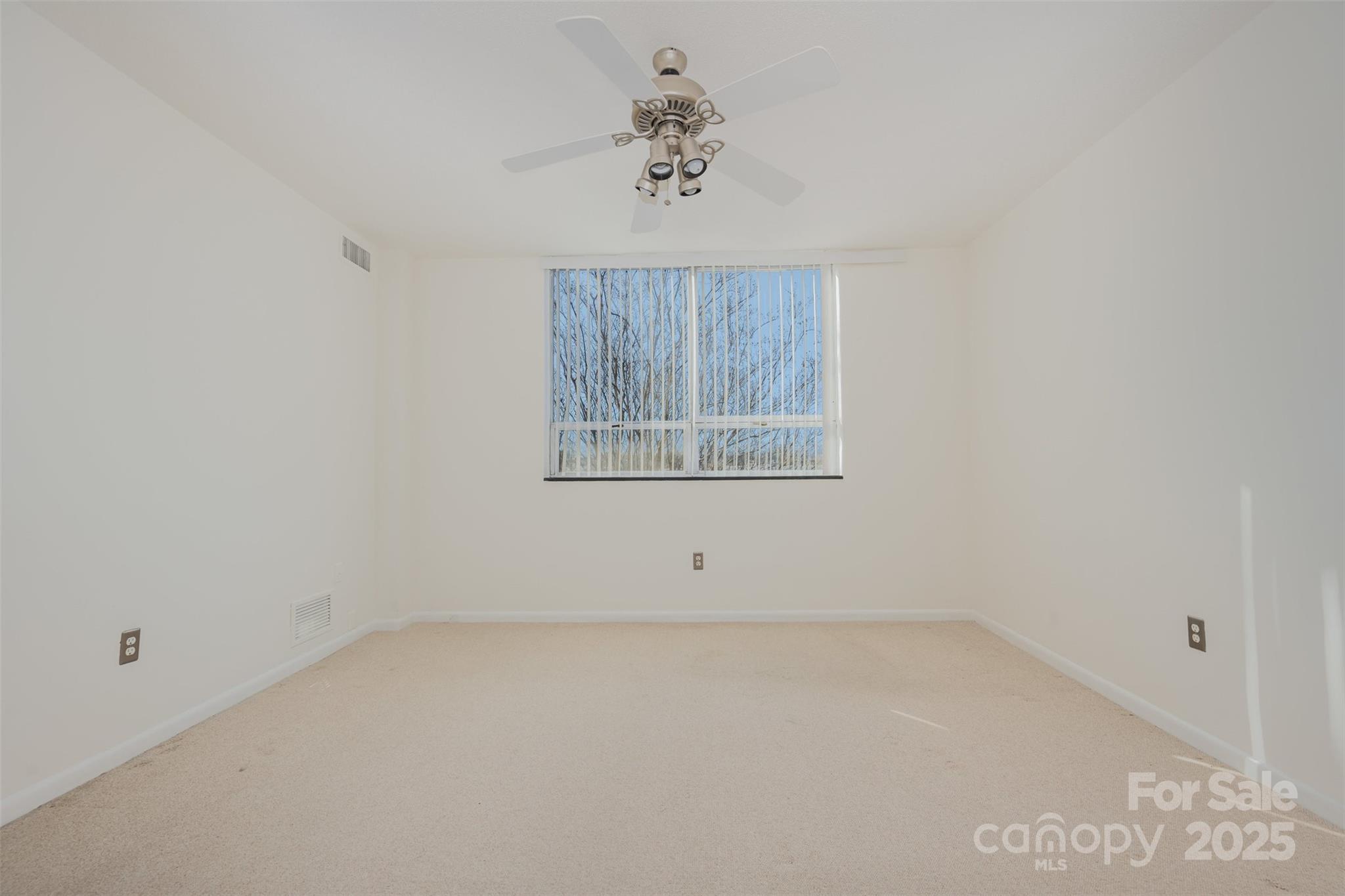 1300 Reece Road, Unit 302 Charlotte, NC 28209 - Photo 10 of 23 an empty room with a window