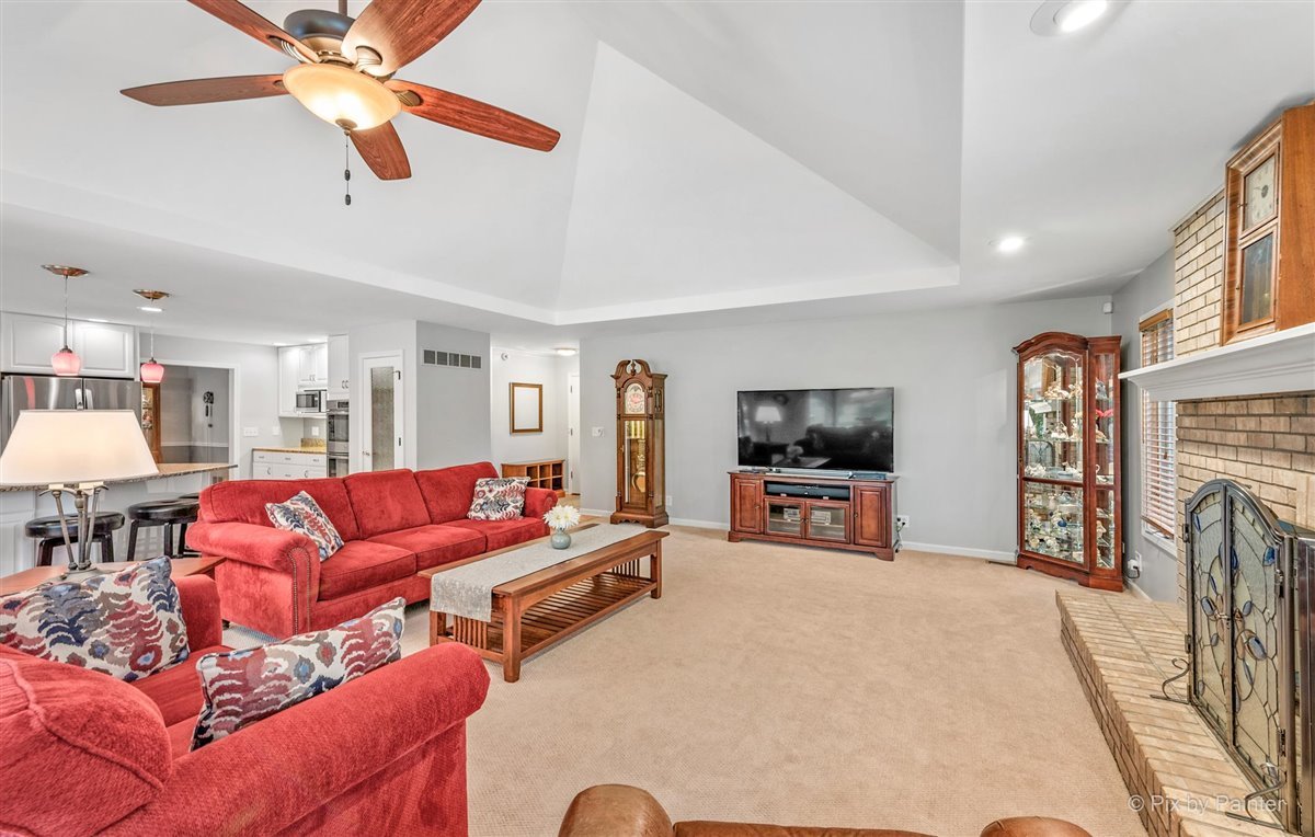 724 Ridgelawn Trail Batavia, IL 60510 - Photo 11 of 32 a living room with furniture and a flat screen tv