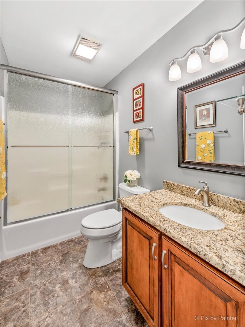 724 Ridgelawn Trail Batavia, IL 60510 - Photo 15 of 32 a bathroom with a granite countertop sink toilet and shower