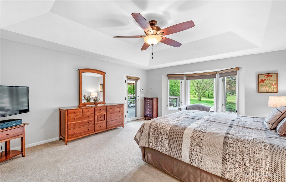 724 Ridgelawn Trail Batavia, IL 60510 - Photo 17 of 32 a bed room with a bed and a television