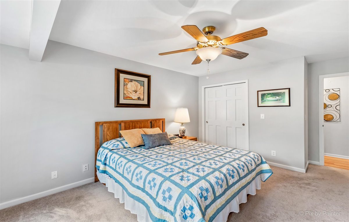 724 Ridgelawn Trail Batavia, IL 60510 - Photo 21 of 32 a bedroom with a bed and window