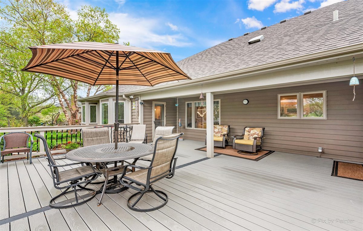 724 Ridgelawn Trail Batavia, IL 60510 - Photo 25 of 32 a view of backyard with seating space and wooden deck