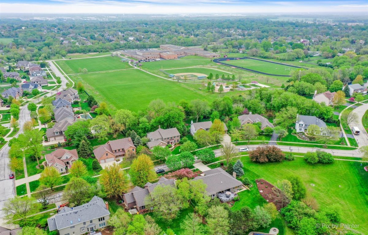 724 Ridgelawn Trail Batavia, IL 60510 - Photo 28 of 32 an aerial view of residential houses with outdoor space and trees