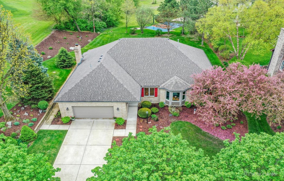 724 Ridgelawn Trail Batavia, IL 60510 - Photo 31 of 32 a aerial view of a house with a yard and potted plants