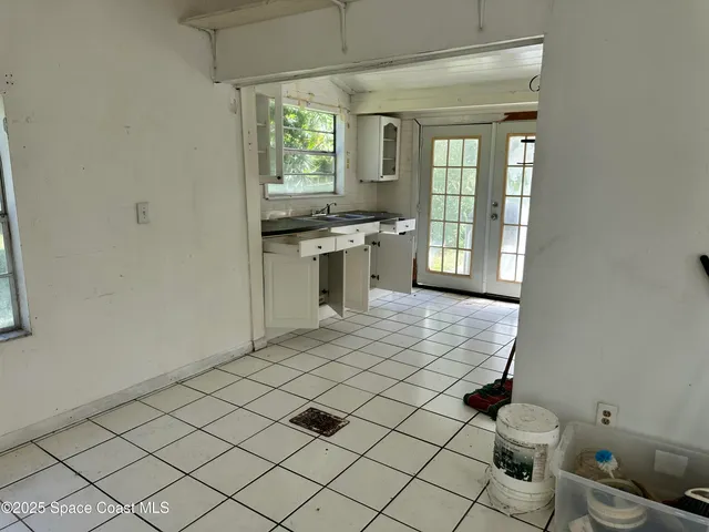 a bathroom with a sink toilet and window