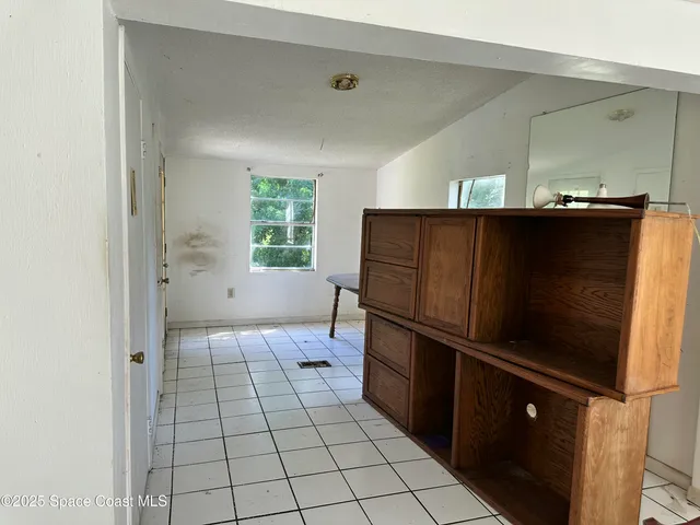 a kitchen with a refrigerator and a sink