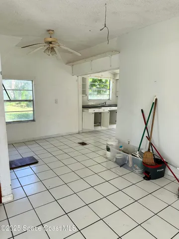 a living room with a black white checkered floor
