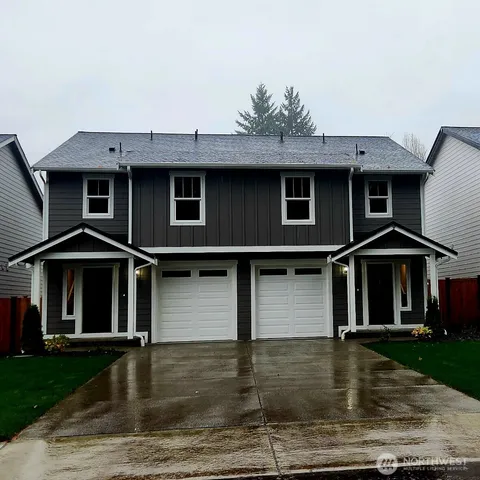 a front view of a house with yard