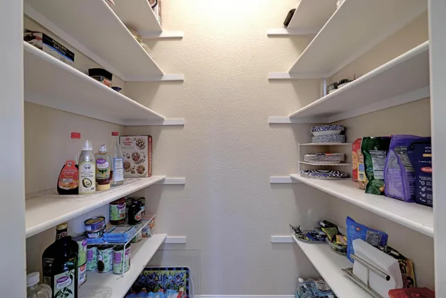 a view of a dining room with furniture and a large window