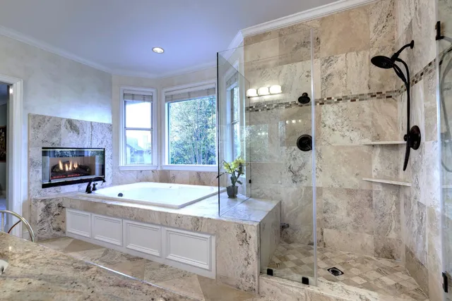 a bedroom with a bed and a ceiling fan