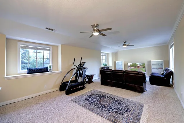 a backyard of a house with outdoor seating